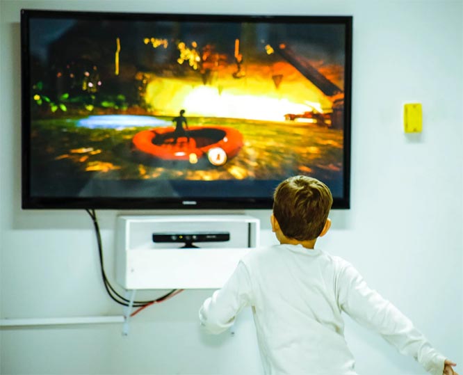 boy-standing-in-front-of-tv