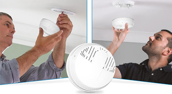 examining-smoke-detector