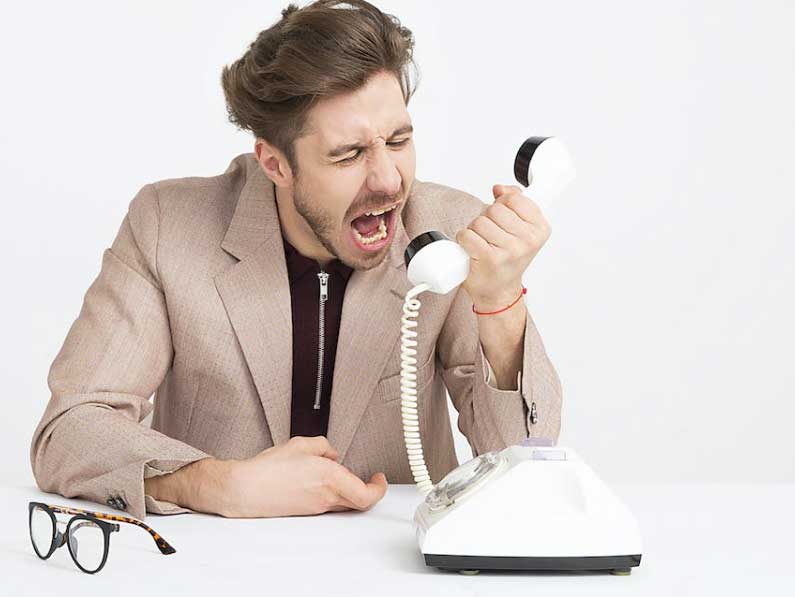 angry at landline phone