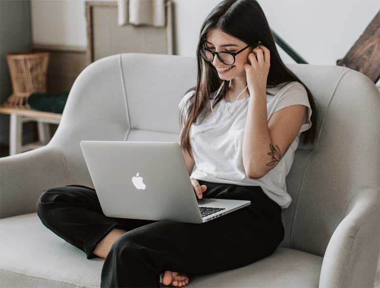 woman watching amazon prime video on laptop